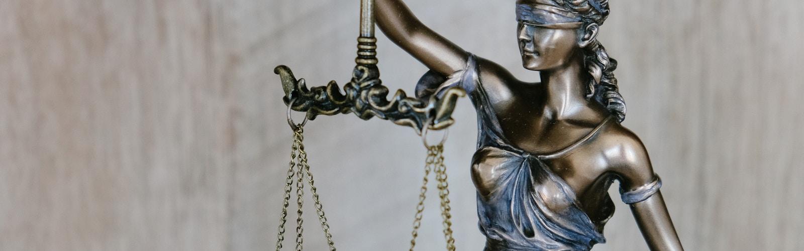 Lady Justice statue representing terms and conditions
